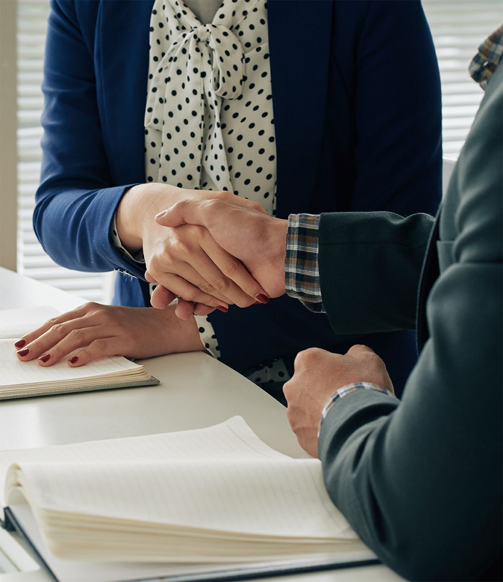 Business people shaking hands after successful meeting